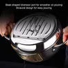 A person is holding a stainless steel pot with a lid, demonstrating its features. Náhled obrázku produktu