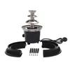 A black and silver chocolate fountain with accessories on a white background. Podgląd zdjęcia produktu
