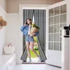 A woman walks through a doorway covered by a magnetic screen door, carrying groceries and talking on her phone. Produktbild-Vorschau