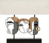 A table lamp with an abstract face design. Podgląd zdjęcia produktu