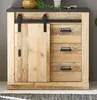 A wooden sideboard with a sliding barn door and drawers, displayed in a studio setting. Produktbild-Vorschau