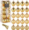 A collection of gold Christmas ornaments in a clear plastic box and arranged in rows. Voir les images du produit