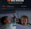 Split image showing two babies in cribs, one sleeping peacefully and the other crying, with text overlay comparing noise levels. Voir les images du produit