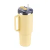 A yellow insulated tumbler with a handle and a straw is shown against a white background. Anteprima dell’immagine prodotto