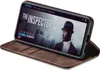 A smartphone in a brown flip case is displayed, showing a movie streaming interface on its screen. Produktbild-Vorschau