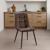 A brown upholstered dining chair with black legs is shown in a kitchen setting. Anteprima dell’immagine prodotto