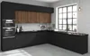 A modern black kitchen with wooden cabinet fronts and a large window. Produktbild-Vorschau