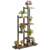 A multi-tiered plant stand with various potted plants on each shelf. Náhled obrázku produktu