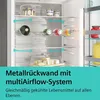 Inside view of a refrigerator with shelves, food items, and airflow indicators. Produktbild-Vorschau