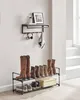 A shelf and shoe rack setup against a wall with a window and stairs in the background. Náhled obrázku produktu