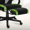 Close-up view of a black gaming chair with a pixelated green and brown trim on the seat and footrest. Produktbild-Vorschau
