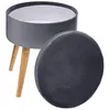 A grey velvet storage stool with wooden legs, shown with its lid off. Podgląd zdjęcia produktu