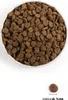 A bowl filled with dog food kibble, with a single piece of kibble shown next to it with a measurement scale. Voir les images du produit