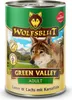 A can of dog food with a wolf's image on it, set against a mountain landscape. Produktbild-Vorschau
