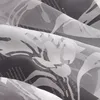 A close-up view of a sheer curtain with a floral pattern and text printed on it. Produktbild-Vorschau