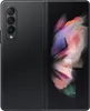 A black Samsung Galaxy Z Fold 3 5G smartphone is shown unfolded, displaying a colorful abstract wallpaper on its inner screen. The back of the phone, with its camera array, is visible on the left. Náhled obrázku produktu