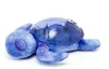 A plush toy turtle lying on its back on a white background. Voir les images du produit