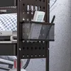 A close-up view of a black metal storage cart with a mesh basket, hooks, and a remote control. Produktbild-Vorschau
