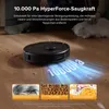 A robot vacuum cleaner is shown on a wooden floor, with text highlighting its suction power and demonstrating its cleaning capabilities with images of hair, pet food, and cereal. A person and a cat are also visible in the background. Produktbild-Vorschau