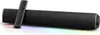 A black soundbar with a remote control on top, set against a white background with colorful lighting at the base. Náhled obrázku produktu