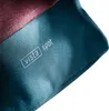 A close-up of a fabric product with a logo and text. Produktbild-Vorschau