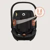 A black baby car seat with magnetic features highlighted by orange circles and a magnetic icon. Produktbild-Vorschau