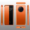 Multiple views of an orange smartphone case with a smart view window. Produktbild-Vorschau