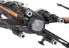 A close-up view of a black toy X-wing fighter with orange accents. Produktbild-Vorschau