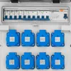 A close-up view of an electrical distribution box with multiple outlets and circuit breakers. Produktbild-Vorschau