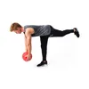 A man is performing a single-leg Romanian deadlift with a slam ball. Produktbild-Vorschau