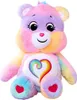 A rainbow-colored teddy bear with a heart emblem on its chest, set against a white background. Produktbild-Vorschau