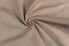 A close-up, swirled view of beige fabric. Produktbild-Vorschau