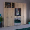 A large wooden wardrobe with mirrored doors, reflecting a bedroom interior. Plants are visible on the left and right sides of the wardrobe. Náhľad obrázku produktu