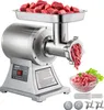 A commercial meat grinder with raw meat in the tray and ground meat in a bowl, along with accessories. Náhľad obrázku produktu