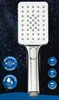 A chrome-finished hand shower head with multiple spray settings, presented against a dark, watery background. Produktbild-Vorschau