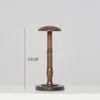 A wooden hat stand is displayed against a plain white background. Produktbild-Vorschau