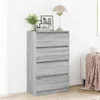 A gray wooden chest of drawers with four drawers is shown in a room. Náhľad obrázku produktu