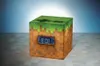 A Minecraft-themed alarm clock is displayed on a patterned surface against a gradient background. Náhľad obrázku produktu