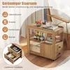 A wooden side table with drawers and shelves, placed next to an armchair. The image highlights storage options. Produktbild-Vorschau
