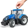 A child's hand is shown interacting with a toy tractor. Voir les images du produit