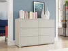 A modern living room with a dresser, books, and decorative vases. Náhled obrázku produktu