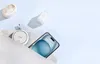 A collection of electronic accessories, including a smartphone, wireless earbuds, a wireless charger, and a wall charger, are arranged on a light blue background. Anteprima dell’immagine prodotto