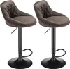 Two brown velvet bar stools with black bases. Voir les images du produit