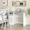 A white desk with a laptop, books, and a plant in a bedroom setting. Náhled obrázku produktu