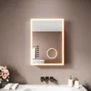 A modern bathroom vanity with a lit mirror, sink, and soap dispensers. Náhled obrázku produktu