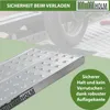 A close-up of a loading ramp with a motorcycle wheel in the background, highlighting safety features. Produktbild-Vorschau