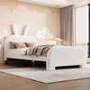 A child's bedroom with a white bed featuring bunny ears on the headboard, decorated with clouds and stars on the wall. Voir les images du produit
