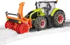 A toy tractor with a snow blower attachment is shown on a surface covered in artificial snow. Anteprima dell’immagine prodotto