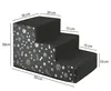 A three-step pet stair with paw and bone pattern on the side, shown with dimensions indicated by measurement lines and text. Produktbild-Vorschau