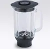 A blender jug with a lid and blades, shown against a light gray background. Voir les images du produit